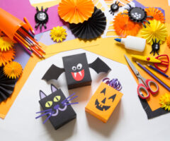 The,child,creates,a,gift,box,of,a,black,cat,bat